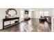 Bright living room featuring hardwood floors, neutral decor, and a modern console table at 1786 Quartz St, Castle Rock, CO 80109