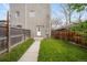 The backyard features a concrete walkway, and a wooden fence at 3028 N Gilpin St, Denver, CO 80205