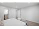 Spacious bedroom with neutral walls, soft carpet, and a glimpse into the en-suite bathroom at 3028 N Gilpin St, Denver, CO 80205