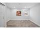 Carpeted bedroom featuring neutral colored walls and a window that allows ample natural light at 3028 N Gilpin St, Denver, CO 80205