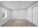 Bright bedroom with a window and carpet flooring, offering a closet for storage at 3028 N Gilpin St, Denver, CO 80205