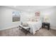 Bright bedroom featuring neutral decor, carpet flooring, and a window that provides plenty of natural light at 3028 N Gilpin St, Denver, CO 80205