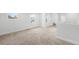 Bright carpeted upstairs hallway that offers plenty of space and leads to multiple rooms at 3028 N Gilpin St, Denver, CO 80205