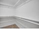 Walk-in closet with shelving and carpet flooring, providing ample storage space at 3028 N Gilpin St, Denver, CO 80205