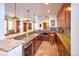 Modern bar with granite countertops, stainless steel appliances, and a backsplash compliments the tile flooring at 5195 Raintree Cir, Parker, CO 80134
