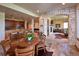 Basement features an open concept living area with a bar, billiard room, fireplace, and a dining area at 5195 Raintree Cir, Parker, CO 80134