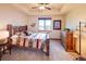 Bedroom featuring a wooden bed frame, carpeted flooring, and natural light from the window at 5195 Raintree Cir, Parker, CO 80134