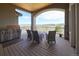 Outdoor deck with a built-in grill and seating area with panoramic views at 5195 Raintree Cir, Parker, CO 80134