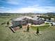 Aerial view showcasing this gorgeous home's roof, landscaping, and location on a golf course at 5195 Raintree Cir, Parker, CO 80134