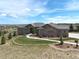 Stunning home with beautiful stone accents, landscaped yard, and pristine walkway at 5195 Raintree Cir, Parker, CO 80134