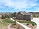 Beautiful single-Gathering home featuring stone accents, a tile roof and well-manicured landscaping at 5195 Raintree Cir, Parker, CO 80134