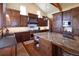 Stylish kitchen featuring stainless steel appliances, custom backsplash, and an island at 5195 Raintree Cir, Parker, CO 80134