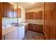 Bright laundry room with modern washer and dryer and ample cabinet space at 5195 Raintree Cir, Parker, CO 80134