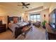 Comfortable main bedroom with carpet, ceiling fan, and window with a picturesque view at 5195 Raintree Cir, Parker, CO 80134