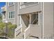 Condominium entrance with stairs, unit numbers, and well-maintained exterior at 5706 W Asbury Pl # 205, Lakewood, CO 80227
