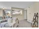 Inviting living room with view to kitchen, a sliding glass door, and modern furnishings at 5706 W Asbury Pl # 205, Lakewood, CO 80227