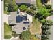 Bird's eye view features a home adorned with solar panels and outdoor living space, surrounded by verdant landscape at 8833 Maplewood Dr, Highlands Ranch, CO 80126