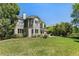 Expansive backyard offers ample space for outdoor activities, complemented by mature trees and lush greenery at 8833 Maplewood Dr, Highlands Ranch, CO 80126