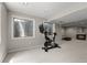 Basement area has an exercise bike and additional recreational space, enhancing fitness and leisure options at 8833 Maplewood Dr, Highlands Ranch, CO 80126