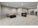 Finished basement boasts a fireplace, neutral tones, and ample space for comfortable living and entertainment at 8833 Maplewood Dr, Highlands Ranch, CO 80126