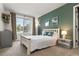 Inviting bedroom featuring a large window, stylish decor, and a cozy, comfortable atmosphere at 8833 Maplewood Dr, Highlands Ranch, CO 80126