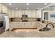 Spacious kitchen with granite countertops, stainless steel appliances, and hardwood flooring at 8833 Maplewood Dr, Highlands Ranch, CO 80126