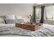 Relaxing primary suite with comfortable bed, plush pillows, and a cozy atmosphere at 8833 Maplewood Dr, Highlands Ranch, CO 80126