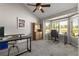 Spacious office with neutral carpet, large window and vaulted ceiling, perfect for remote work at 8833 Maplewood Dr, Highlands Ranch, CO 80126