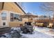 Backyard patio featuring outdoor dining, string lights, and comfortable seating, perfect for entertaining at 16102 Grebe Pl, Parker, CO 80134