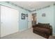 This cozy bedroom features a fun dog themed border and a comfortable sitting area at 16102 Grebe Pl, Parker, CO 80134