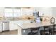 Modern kitchen featuring granite countertops, stainless steel appliances, and white cabinets at 16102 Grebe Pl, Parker, CO 80134