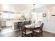 Bright kitchen featuring white cabinets, granite countertops, and stainless steel appliances, perfect for modern living and dining at 16102 Grebe Pl, Parker, CO 80134