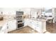 Modern kitchen featuring granite countertops, stainless steel appliances, and ample storage at 16102 Grebe Pl, Parker, CO 80134