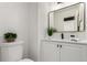 Contemporary bathroom featuring a sleek vanity, modern fixtures, and clean white finishes at 9400 E Iliff Ave # 103, Denver, CO 80231