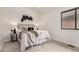 Cozy bedroom showcasing neutral tones, a plush bed, and a serene ambiance at 9400 E Iliff Ave # 103, Denver, CO 80231