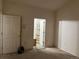 This bedroom features neutral walls, carpet flooring, and two doors leading to other areas of the house at 14400 Albrook Dr # 88, Denver, CO 80239