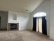 Bright living room featuring a fireplace and a large window for ample natural light at 14400 Albrook Dr # 88, Denver, CO 80239