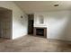Living room showcasing a fireplace, neutral carpet, and white walls for a clean look at 14400 Albrook Dr # 88, Denver, CO 80239