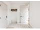 Clean entryway with built-in bench, storage, and patterned tile flooring at 2020 Teller St, Lakewood, CO 80214