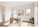 Bright home office with modern desk, neutral decor, and natural light at 2020 Teller St, Lakewood, CO 80214