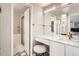 Updated bathroom features a vanity with marble countertops, stylish fixtures, and a walk-in shower at 7865 E Mississippi Ave # 1501, Denver, CO 80247