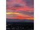 Beautiful city view with colorful sunset over mountains and skyline at 7865 E Mississippi Ave # 1501, Denver, CO 80247