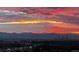 Scenic city view showcasing a vibrant sunset over mountains and the skyline at 7865 E Mississippi Ave # 1501, Denver, CO 80247