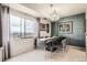 Elegant dining room with a city view, stylish chandelier, and decorative wall art at 7865 E Mississippi Ave # 1501, Denver, CO 80247