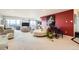 Open living room with plush seating, piano, and cityscape view from large balcony doors at 7865 E Mississippi Ave # 1501, Denver, CO 80247