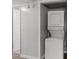 Stackable washer and dryer in closet at 10211 Ura Ln # 7-108, Thornton, CO 80260