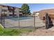 Community swimming pool with metal fence at 10211 Ura Ln # 7-108, Thornton, CO 80260