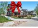 Charming townhome with a well-manicured lawn and inviting outdoor patio space, perfect for relaxation and entertaining at 12497 W Virginia Ave, Lakewood, CO 80228