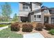 Enjoy outdoor living on the townhome patio, featuring a charming wood fence and comfortable seating at 12497 W Virginia Ave, Lakewood, CO 80228