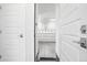 Entry showing garage, with door opening to bright, well-lit garage space at 12497 W Virginia Ave, Lakewood, CO 80228